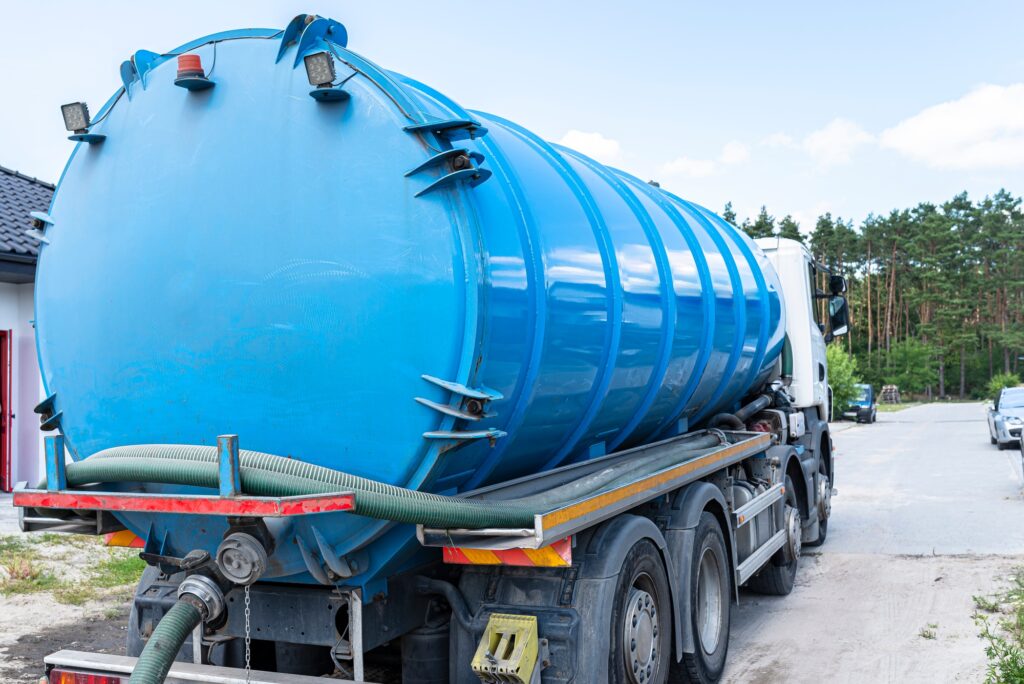 A truck with a large tank for pumping out a septic tank with a capacity of more than 20 cubic meters